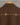 Back details of brown jacket with zari flower motif displayed against a wall.
