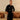 Black linen shacket and trouser set is imagined as a midnight landscape, calm and self-lit on a model.